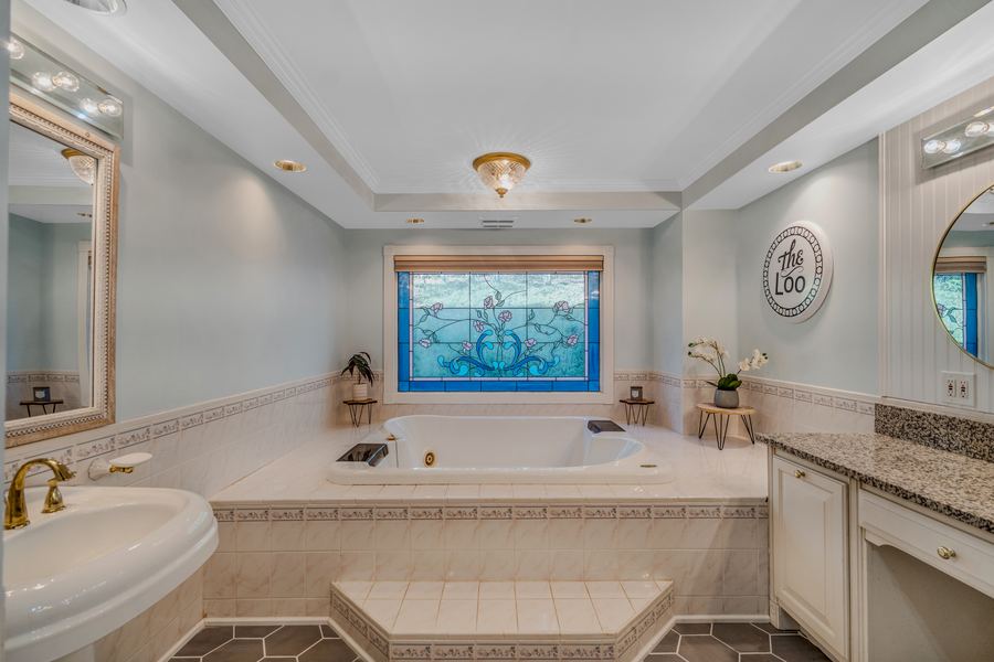 Primary bath, original stained glass, 144 Porter Road
